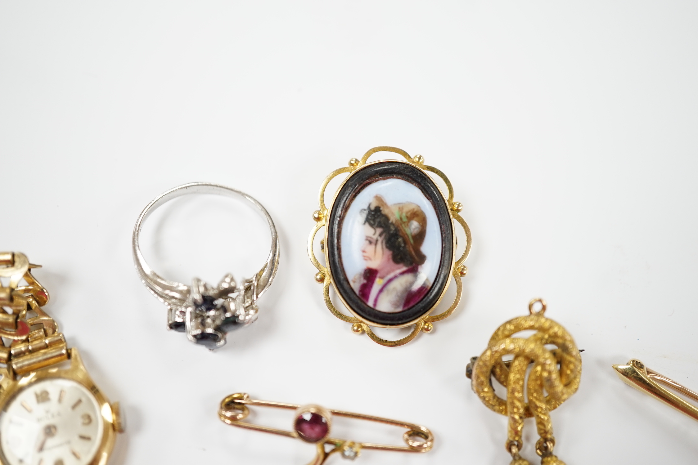 A group of assorted jewellery including a 15ct and single stone amethyst bar brooch, three other yellow metal and gem set bar brooches including two 9ct, a 9ct and enamel brooch, an 18ct watch, a 9ct fob watch and two ot